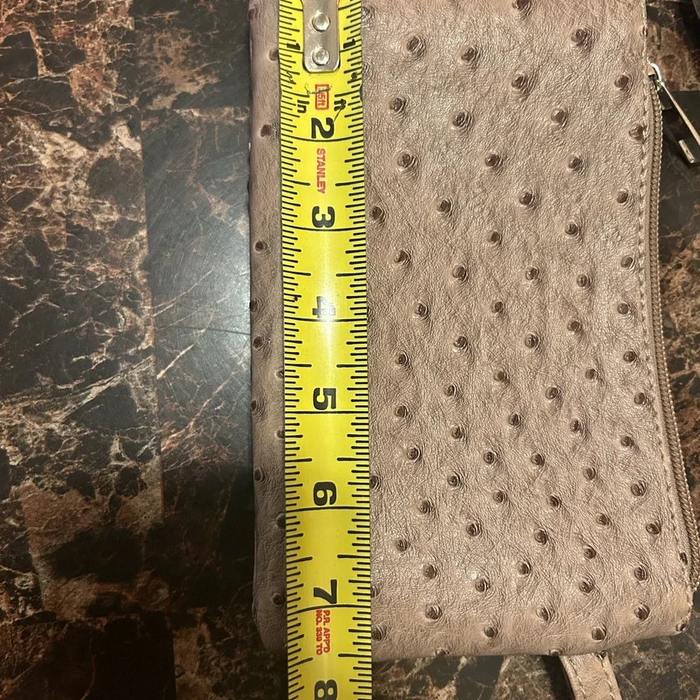 Beige Ostrich textured wristlet with polka dot lining
